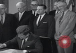 Image of President Kennedy signing Washington DC USA, 1963, second 45 stock footage video 65675080556