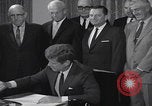 Image of President Kennedy signing Washington DC USA, 1963, second 46 stock footage video 65675080556