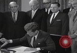 Image of President Kennedy signing Washington DC USA, 1963, second 48 stock footage video 65675080556