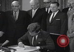 Image of President Kennedy signing Washington DC USA, 1963, second 49 stock footage video 65675080556