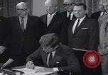 Image of President Kennedy signing Washington DC USA, 1963, second 50 stock footage video 65675080556