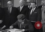 Image of President Kennedy signing Washington DC USA, 1963, second 51 stock footage video 65675080556