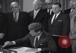 Image of President Kennedy signing Washington DC USA, 1963, second 52 stock footage video 65675080556
