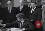 Image of President Kennedy signing Washington DC USA, 1963, second 53 stock footage video 65675080556