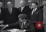 Image of President Kennedy signing Washington DC USA, 1963, second 54 stock footage video 65675080556