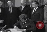 Image of President Kennedy signing Washington DC USA, 1963, second 55 stock footage video 65675080556