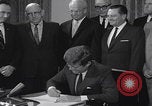 Image of President Kennedy signing Washington DC USA, 1963, second 56 stock footage video 65675080556