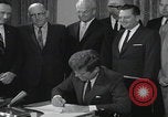 Image of President Kennedy signing Washington DC USA, 1963, second 57 stock footage video 65675080556
