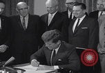 Image of President Kennedy signing Washington DC USA, 1963, second 58 stock footage video 65675080556
