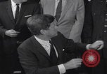 Image of President Kennedy signing Washington DC USA, 1963, second 61 stock footage video 65675080556