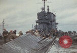 Image of USS Saratoga sailors clearing debris Pacific Ocean, 1945, second 5 stock footage video 65675080635