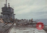 Image of USS Saratoga sailors clearing debris Pacific Ocean, 1945, second 6 stock footage video 65675080635