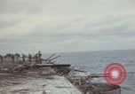 Image of USS Saratoga sailors clearing debris Pacific Ocean, 1945, second 7 stock footage video 65675080635