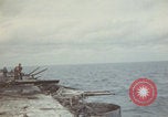 Image of USS Saratoga sailors clearing debris Pacific Ocean, 1945, second 8 stock footage video 65675080635