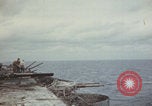 Image of USS Saratoga sailors clearing debris Pacific Ocean, 1945, second 10 stock footage video 65675080635