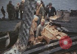 Image of USS Saratoga sailors clearing debris Pacific Ocean, 1945, second 19 stock footage video 65675080635