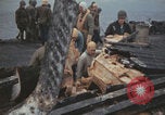 Image of USS Saratoga sailors clearing debris Pacific Ocean, 1945, second 21 stock footage video 65675080635