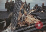 Image of USS Saratoga sailors clearing debris Pacific Ocean, 1945, second 23 stock footage video 65675080635
