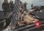 Image of USS Saratoga sailors clearing debris Pacific Ocean, 1945, second 24 stock footage video 65675080635