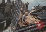 Image of USS Saratoga sailors clearing debris Pacific Ocean, 1945, second 25 stock footage video 65675080635
