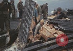 Image of USS Saratoga sailors clearing debris Pacific Ocean, 1945, second 27 stock footage video 65675080635