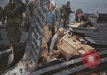 Image of USS Saratoga sailors clearing debris Pacific Ocean, 1945, second 28 stock footage video 65675080635