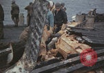 Image of USS Saratoga sailors clearing debris Pacific Ocean, 1945, second 30 stock footage video 65675080635