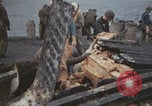 Image of USS Saratoga sailors clearing debris Pacific Ocean, 1945, second 32 stock footage video 65675080635