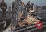Image of USS Saratoga sailors clearing debris Pacific Ocean, 1945, second 33 stock footage video 65675080635