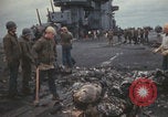 Image of USS Saratoga sailors clearing debris Pacific Ocean, 1945, second 35 stock footage video 65675080635