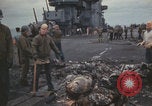 Image of USS Saratoga sailors clearing debris Pacific Ocean, 1945, second 39 stock footage video 65675080635