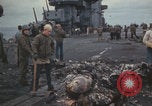 Image of USS Saratoga sailors clearing debris Pacific Ocean, 1945, second 40 stock footage video 65675080635