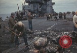 Image of USS Saratoga sailors clearing debris Pacific Ocean, 1945, second 45 stock footage video 65675080635