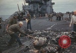 Image of USS Saratoga sailors clearing debris Pacific Ocean, 1945, second 52 stock footage video 65675080635