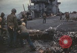 Image of USS Saratoga sailors clearing debris Pacific Ocean, 1945, second 55 stock footage video 65675080635