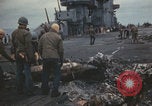 Image of USS Saratoga sailors clearing debris Pacific Ocean, 1945, second 56 stock footage video 65675080635