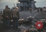 Image of USS Saratoga sailors clearing debris Pacific Ocean, 1945, second 58 stock footage video 65675080635
