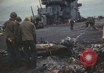 Image of USS Saratoga sailors clearing debris Pacific Ocean, 1945, second 59 stock footage video 65675080635