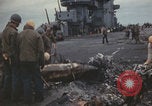 Image of USS Saratoga sailors clearing debris Pacific Ocean, 1945, second 60 stock footage video 65675080635