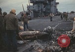 Image of USS Saratoga sailors clearing debris Pacific Ocean, 1945, second 62 stock footage video 65675080635
