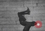 Image of boy doing acrobatic stunts New York City USA, 1898, second 4 stock footage video 65675080653