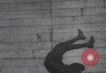 Image of boy doing acrobatic stunts New York City USA, 1898, second 21 stock footage video 65675080653