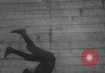 Image of boy doing acrobatic stunts New York City USA, 1898, second 27 stock footage video 65675080653