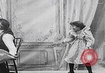 Image of little girl mischief United States USA, 1900, second 11 stock footage video 65675080662