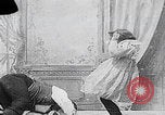 Image of little girl mischief United States USA, 1900, second 26 stock footage video 65675080662