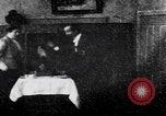 Image of couple perform magic tricks United States USA, 1900, second 44 stock footage video 65675080679