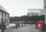 Image of US Army enter Normandy village France, 1944, second 8 stock footage video 65675080711