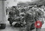 Image of German prisoners carry wounded Saint Mere Eglise France, 1944, second 3 stock footage video 65675080724