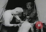 Image of German prisoners carry wounded Saint Mere Eglise France, 1944, second 6 stock footage video 65675080724