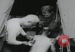 Image of German prisoners carry wounded Saint Mere Eglise France, 1944, second 7 stock footage video 65675080724